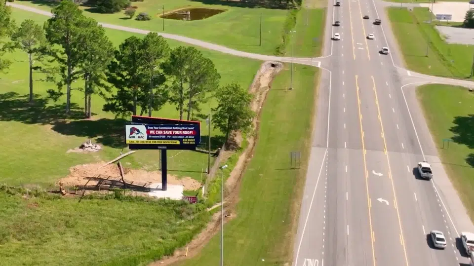a sign on the side of a road